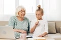 Grandmother selfie family hugging granddaughter togetherness child sofa video smiling call laptop education bonding Royalty Free Stock Photo