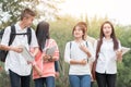 Education learning Concept: Confident Asian Students groups walking hold books, tablet notebook at Outside classroom in university