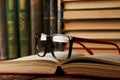 Education learning concept with opened book and glasses in old l Royalty Free Stock Photo