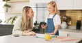 Education, mother and girl writing in kitchen for school task, assignment or homework. Help, learning and mom with child Royalty Free Stock Photo