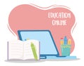 Education online, laptop open book pen and stationery objects
