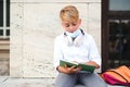 Education during pandemic. Tired boy in safety mask after lessons. Coronavirus and school life