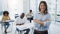 Education, portrait and woman professor in a classroom with students for teaching, knowledge and motivation. College Royalty Free Stock Photo