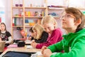 Education - Pupils at school doing homework Royalty Free Stock Photo