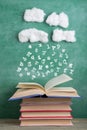 Education and reading creative concept rain of letters falls in to an open book, inspiration for a writing a fairy tale Royalty Free Stock Photo