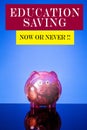 EDUCATION SAVING CONCEPT: Red piggy bank on a blue background wi