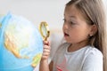 Education and school concept. child girl pointing at globe. Royalty Free Stock Photo