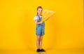 Education and school concept. small girl with triangle ruler. Math science concept with school lesson items. back to