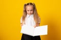 Education and school concept. Smiling little student girl with book. Copy space Royalty Free Stock Photo