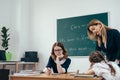 Education school lesson female teacher with pupils Royalty Free Stock Photo