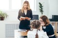 Education school lesson female teacher read book to her pupils Royalty Free Stock Photo