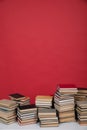 education science learning library stack of books on a red background