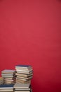 education science learning library stack of books on a red background
