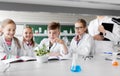 Kids or students with plant at biology class Royalty Free Stock Photo