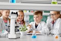 Kids or students with plant at biology class Royalty Free Stock Photo