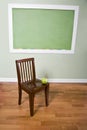 Education still life - chalkboard, chair and apple Royalty Free Stock Photo