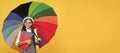 education. teen child under colorful parasol. kid in beret with rainbow umbrella. Child with autumn umbrella, rainy Royalty Free Stock Photo