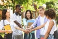 Education And Unity. Group Of International Students Stacking Hands Together Outdoors Royalty Free Stock Photo