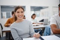 Education, university student and girl writing in classroom, lecture notes or studying for paper test. Learning, college Royalty Free Stock Photo