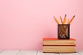 education and wisdom concept - books on wooden table, color background Royalty Free Stock Photo