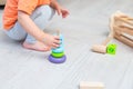 Education wooden toys. A child plays with wooden toys Royalty Free Stock Photo