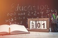 Education word on chalkboard with school books on desk, education concept Royalty Free Stock Photo