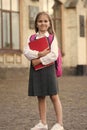 Education your door to the future. Happy child hold books outdoors. Back to school supplies. Formal uniform. Elementary