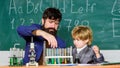 Education Your Door to The Future. Pupil kid in the chemistry class confidence charisma. Back to school. bearded man