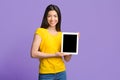 Educational App. Happy Asian Girl Showing Digital Tablet With Black Blank Screen Royalty Free Stock Photo
