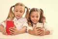 Educational application. Online life concept. Schoolgirls cute pupils use smartphones big diagonal screen check social