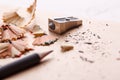 A sharp gray pencil with a metal sharpener on the table