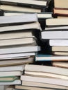 Educational books piled on table