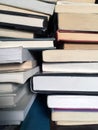 Educational books piled on table