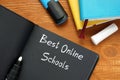 Educational concept about Best Online Schools with sign on the sheet