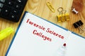 Educational concept about Forensic Science Colleges with sign on the sheet