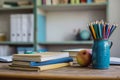 Educational essentials empty desk with school supplies and book stack Royalty Free Stock Photo