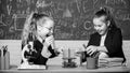 Educational experiment concept. Microscope and test tubes on table. Be careful performing chemical reaction. Basic Royalty Free Stock Photo