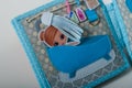 Educational felt book with small wooly details and buttons for little children. Girl in bathroom in bathtube. Leisure