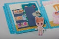 Educational felt book with small wooly details and buttons for little children. Girl in kitchen at fridge and shelves with food.