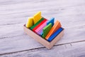 Colorful geometric figures in the wooden box. Education concept. Royalty Free Stock Photo