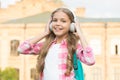 Educational podcast. Kid girl enjoy music. Pleasant time. Child headphones listen music. Audio book concept. Studying