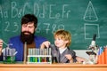 Educational school program. Teacher and child test tubes. Perseverance pays off. Chemical experiment. Symptoms of ADHD Royalty Free Stock Photo