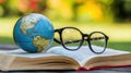Educational study concept illustrated by globe and glasses on book emphasizing global learning and international education program Royalty Free Stock Photo