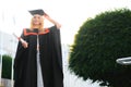 Educational theme: graduating student girl in an academic gown. Royalty Free Stock Photo