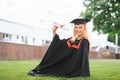 Educational theme: graduating student girl in an academic gown. Royalty Free Stock Photo