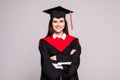 Educational theme. Graduating student girl in an academic gown. Isolated over white background Royalty Free Stock Photo