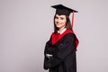 Educational theme. Graduating student girl in an academic gown. Isolated over white background Royalty Free Stock Photo