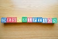 Educational toy cubes with letters organised to display word DESCRIPTION - editing metadata and Search engine