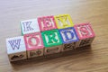 Educational toy cubes with letters organised to display word KEYWORDS - editing metadata and Search engine optimisation
