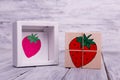 Ecological wooden cubes with fruits. Colorful geometric figures on the wooden background. Royalty Free Stock Photo